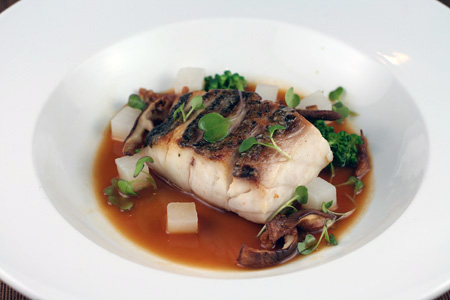 Seared wild striped bass with duck broth