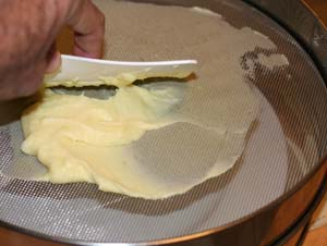 passing potatoes through a drum